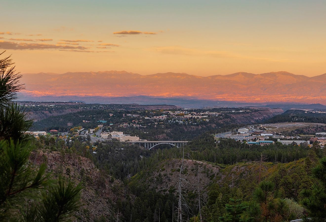 Town of Los Alamos, New Mexico on the left and center, the Omega Bridge in the middle and the Los Alamos National Laboratories on the right.